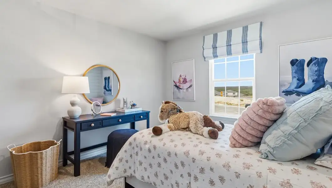 Furnished interior in a model home at The Woodlands at Medina Hills in Mico (Image 21).