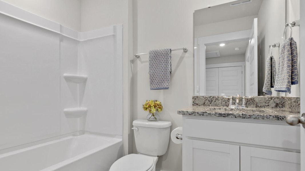 Furnished interior in a model home at Waterside Townhomes in Surf City (Image 28).