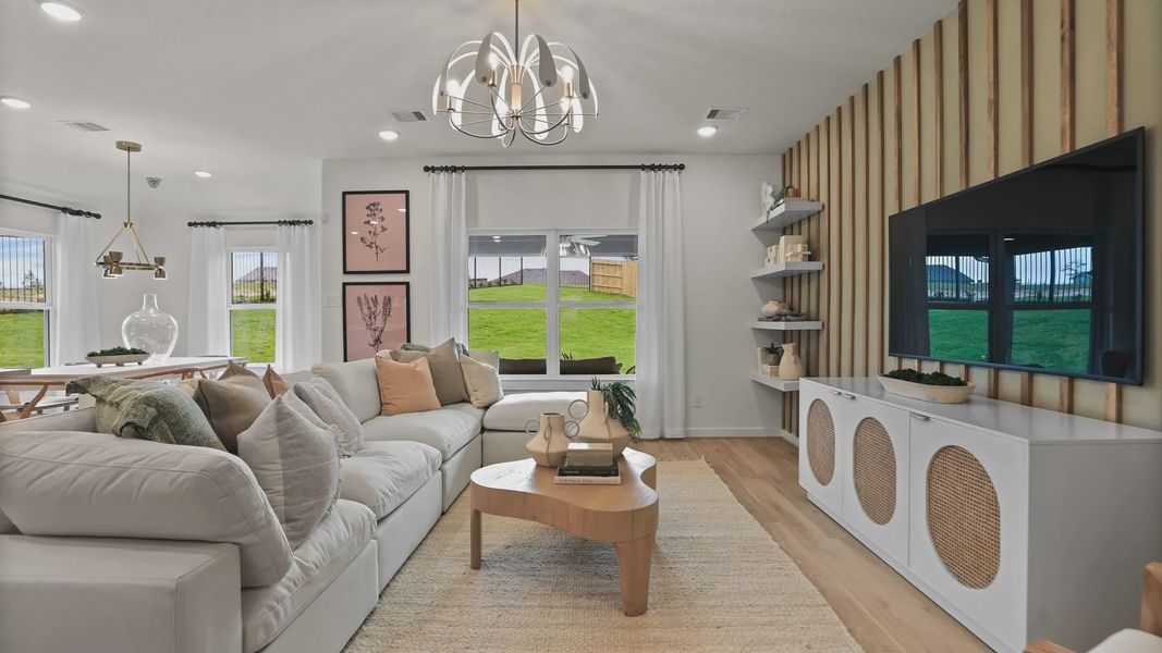 Experience refined living with a plush sofa, sleek accent wall, and designer lighting in Mostyn Springs. Experience refined living with a plush sofa, sleek accent wall, and designer lighting in Mostyn Springs.