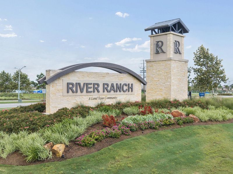 Entrance to the River Ranch Meadows community in Dayton, TX, featuring signage and landscaping (Image 2). Entrance to the River Ranch Meadows community in Dayton, TX, featuring signage and landscaping (Image 2).