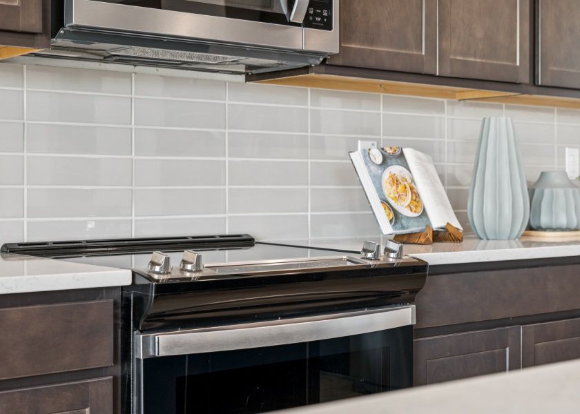 A kitchen with a stove and oven.