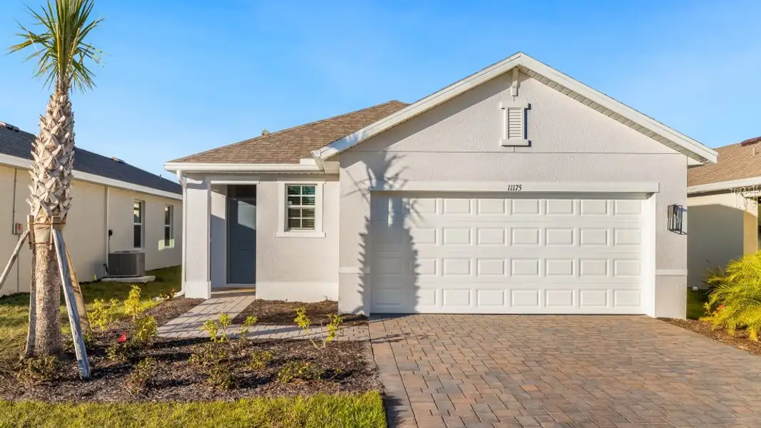 Front exterior of a home in the Bentley Crossing community, located in Fort Myers, FL (Image 11).