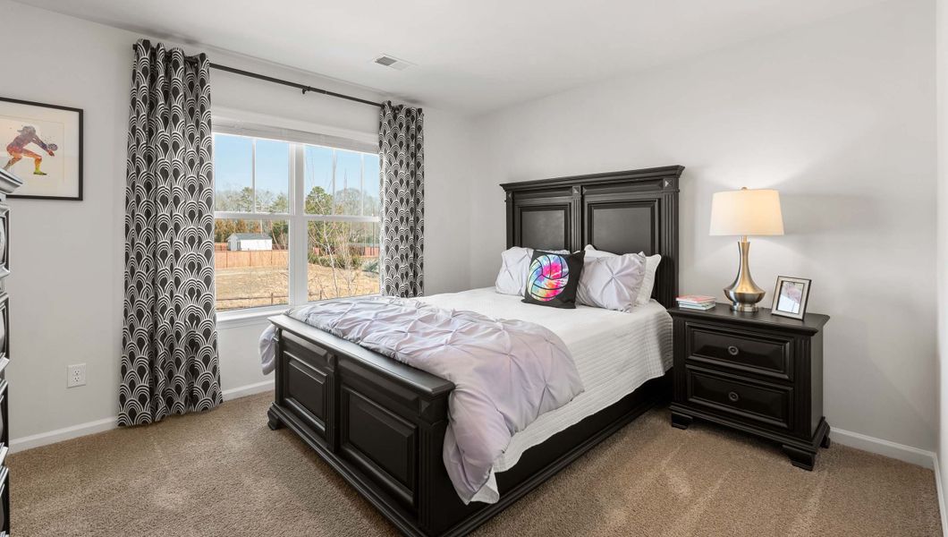 Furnished interior in a model home at Paddock Point in Roebuck (Image 16).