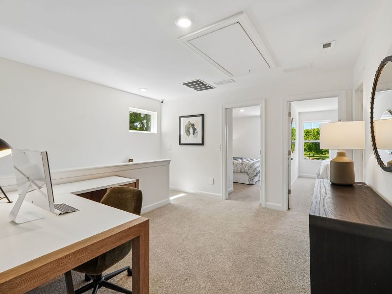 Furnished interior in a model home at Rocky River Towns in Charlotte (Image 11).