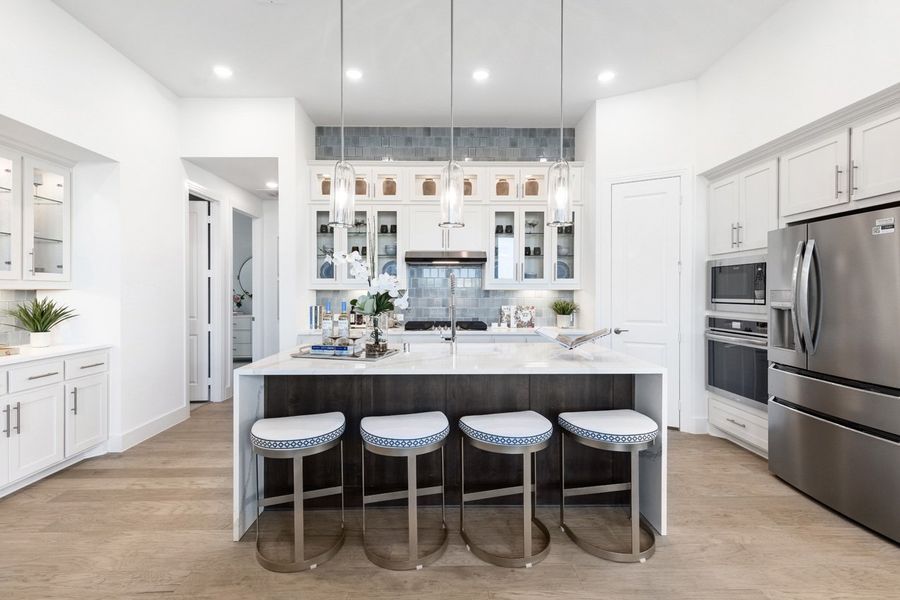 Furnished interior in a model home at Wildrye in Waller (Image 4).