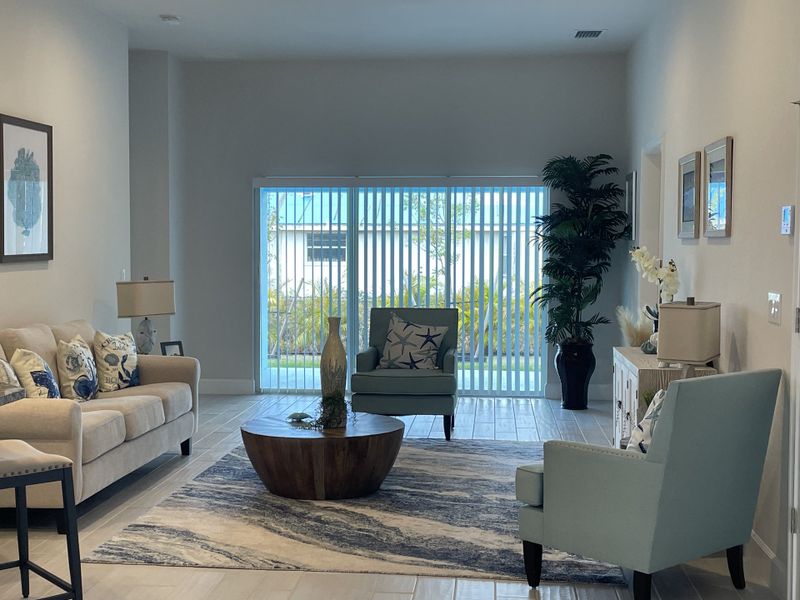 Furnished interior in a model home at Watercress Cove in North Port (Image 4).