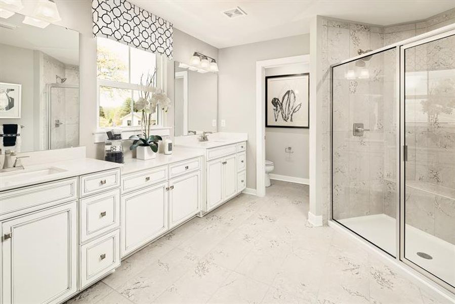 Feel the stress of the day melt away during your nighttime routines in your luxurious en suite bath.