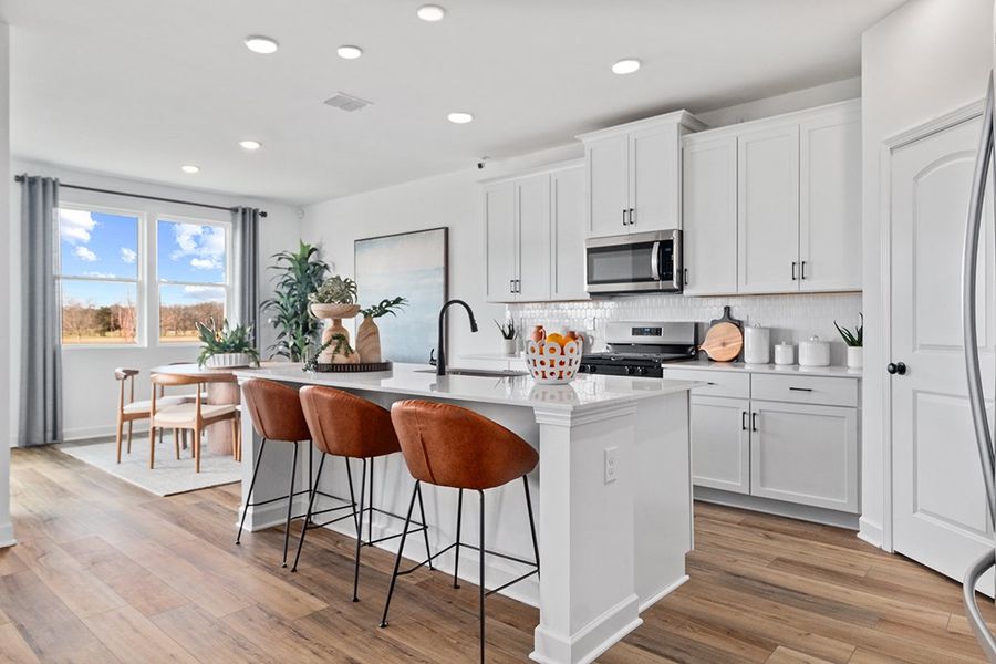 A kitchen with white cabinets. A kitchen with white cabinets.