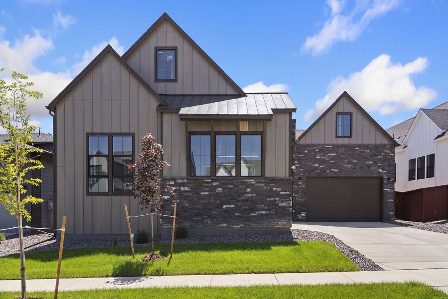 Front exterior of a home in the The Fairways at RainDance community, located in Windsor, CO (Image 2).