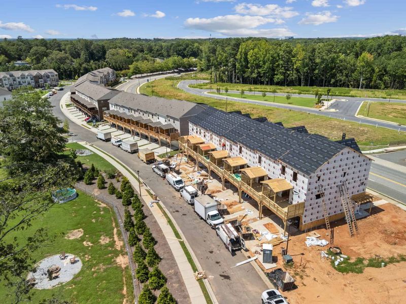 Aerial view of the Towns at Enclave community in Lawrenceville, GA, showing layout and nearby surroundings (Image 15). Aerial view of the Towns at Enclave community in Lawrenceville, GA, showing layout and nearby surroundings (Image 15).