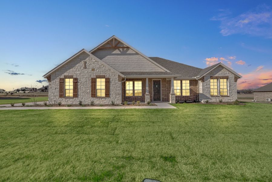 Front exterior of a home in the Honeysuckle Ranch community, located in Paradise, TX (Image 1).