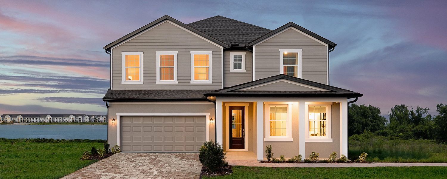 Front exterior of a home in the Catamaran Cove Traditional community, located in Rockledge, FL (Image 1).