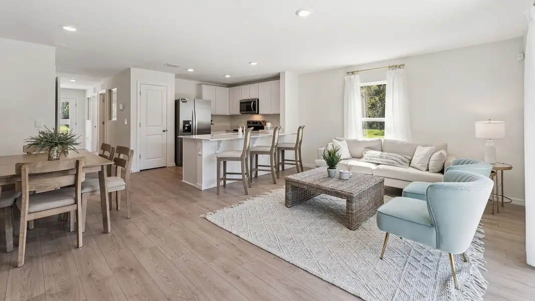 Furnished interior in a model home at Fish Lake Cove in Kissimmee (Image 5).