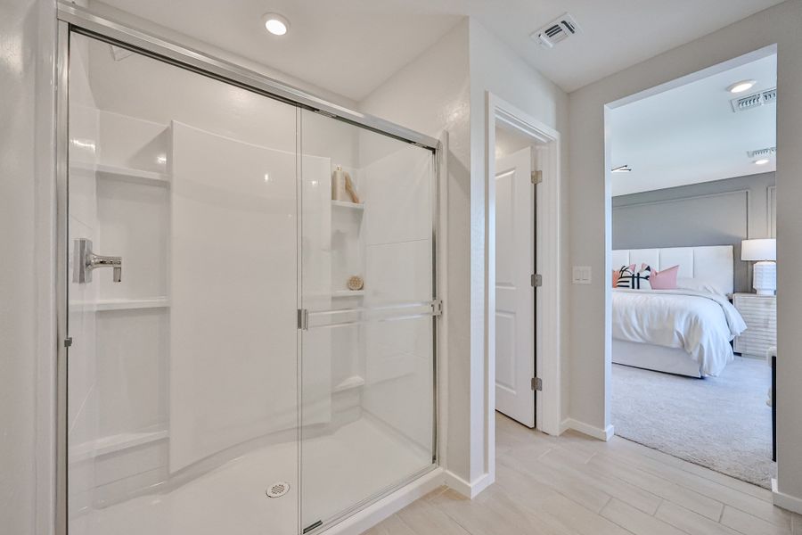 A bathroom with a glass shower.