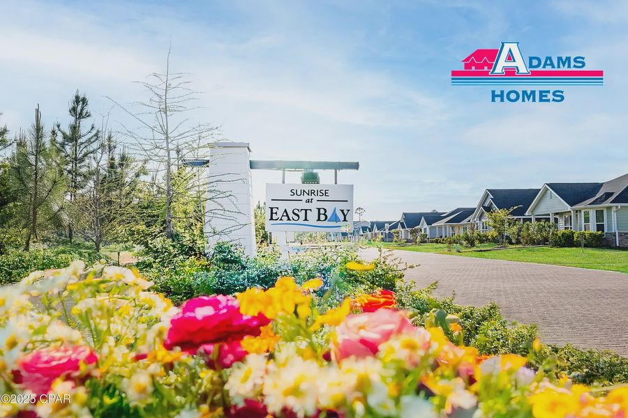 Entrance to the East Bay community in Panama City, FL, featuring signage and landscaping (Image 1). Entrance to the East Bay community in Panama City, FL, featuring signage and landscaping (Image 1).