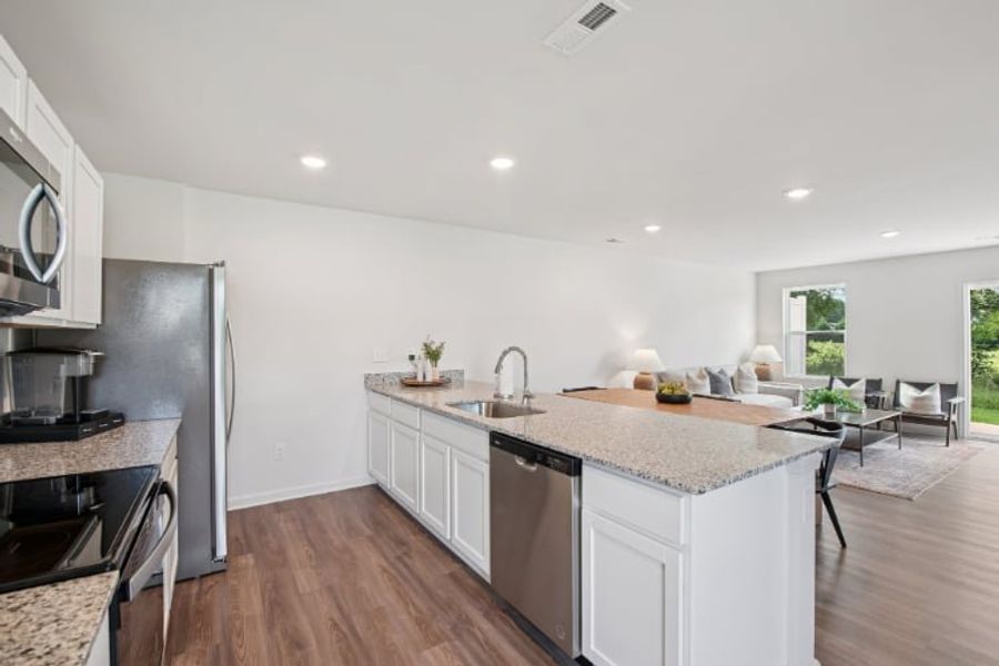 A kitchen with white cabinets. A kitchen with white cabinets.