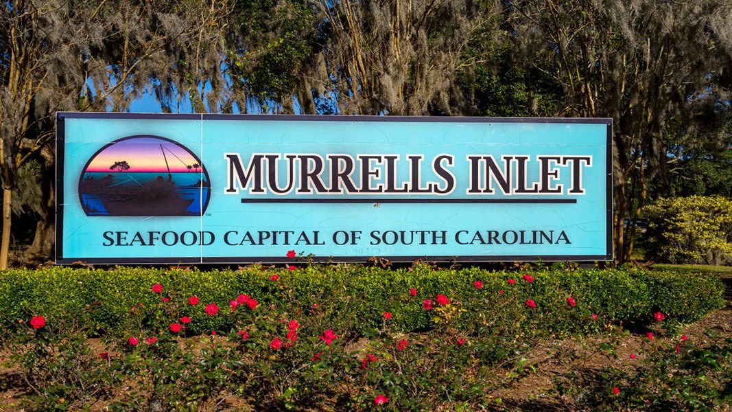 Entrance to the Heron Pointe community in Myrtle Beach, SC, featuring signage and landscaping (Image 2). Entrance to the Heron Pointe community in Myrtle Beach, SC, featuring signage and landscaping (Image 2).