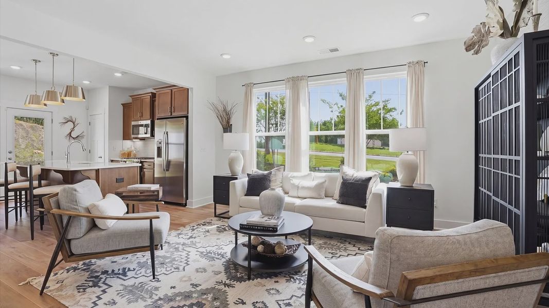Hardwood flooring and high standards define this vibrant family room ideal for everyday living at the Marion Square community