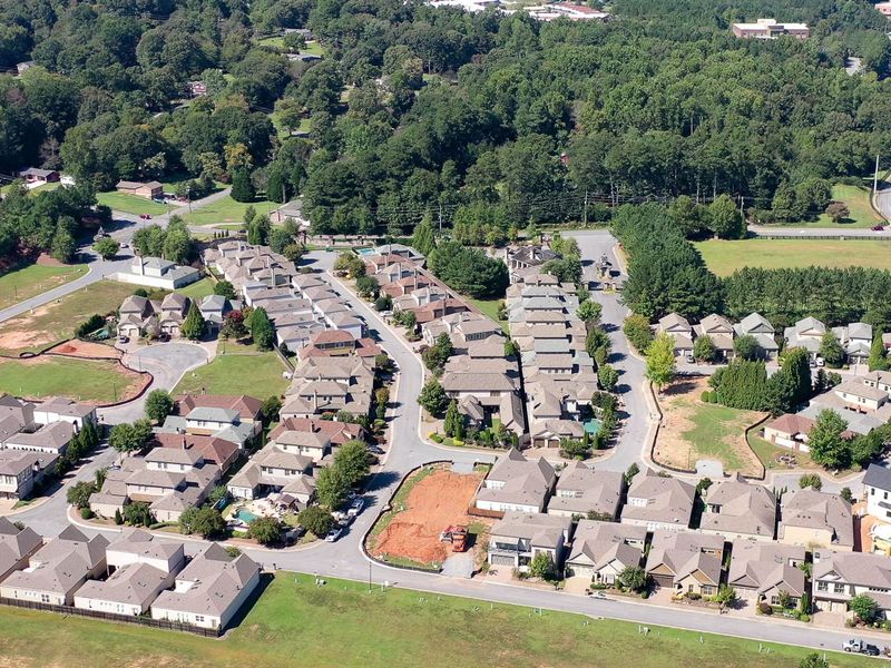 Aerial view of the The Village at Towne Lake community in Woodstock, GA, showing layout and nearby surroundings (Image 12).