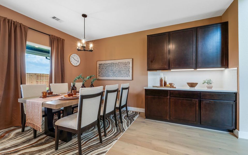 Furnished interior in a model home at Harvest Pointe in Needville (Image 10).