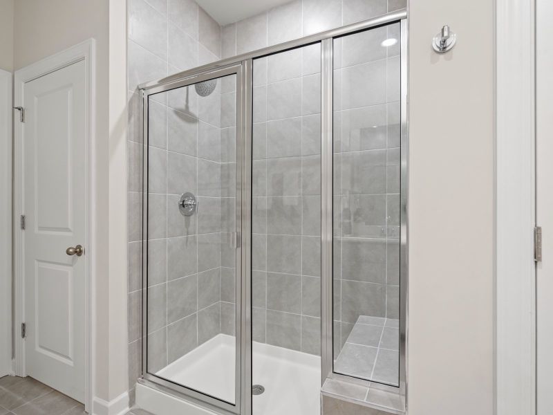 The primary ensuite boasts duel sinks, tile shower and large walk-in closet.