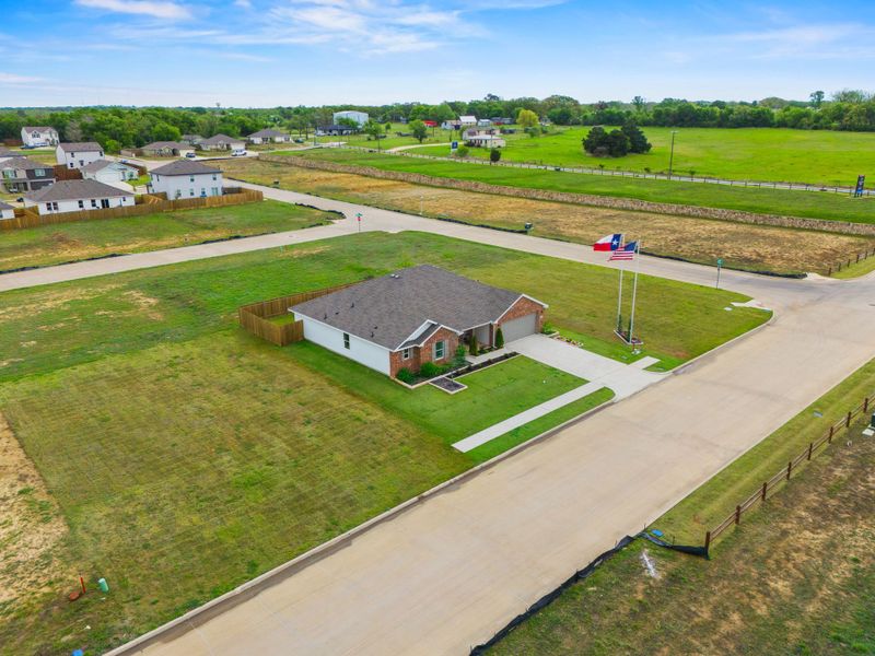 A building in a field. A building in a field.