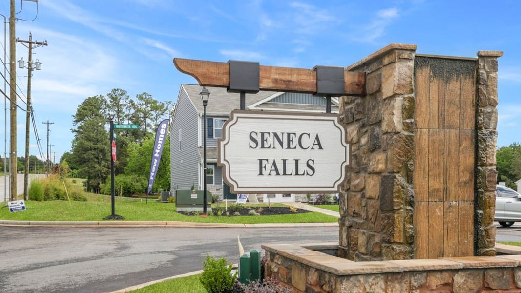 Entrance to the Seneca Falls community in Seneca, SC, featuring signage and landscaping (Image 11). Entrance to the Seneca Falls community in Seneca, SC, featuring signage and landscaping (Image 11).