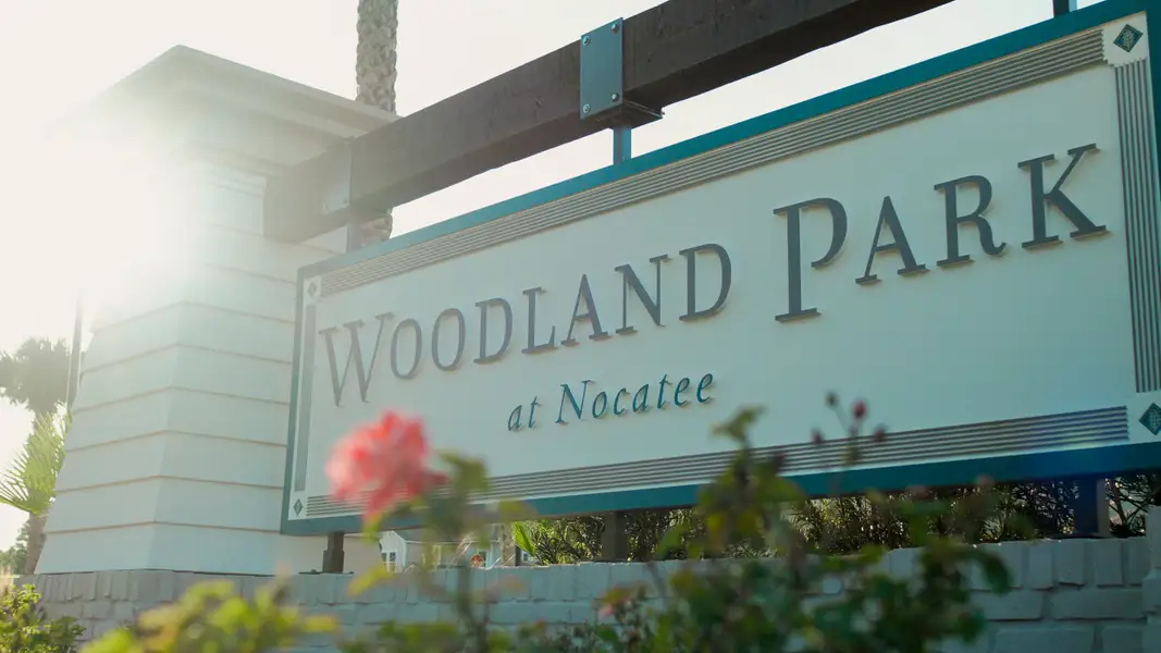 Entrance to the Woodland Park community in Ponte Vedra Beach, FL, featuring signage and landscaping (Image 13).