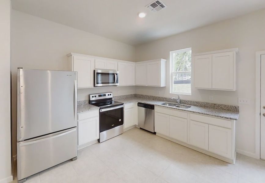 Furnished interior in a model home at Pelham Square in Deland (Image 3).