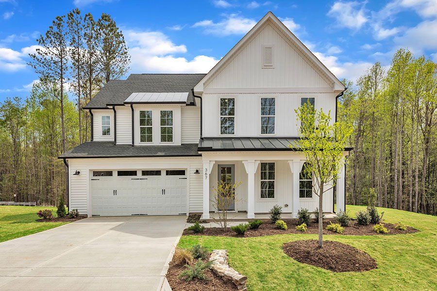 Front exterior of a home in the WyndWater community, located in Hampstead, NC (Image 27).
