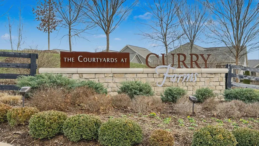Entrance to the The Courtyards at Curry Farms community in Louisville, KY, featuring signage and landscaping (Image 2).