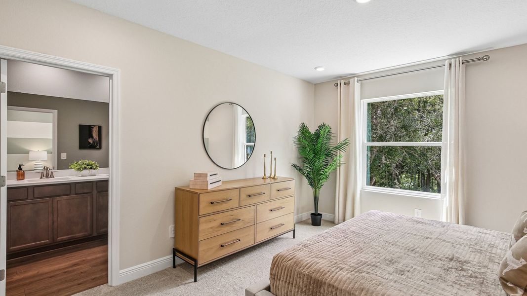Furnished interior in a model home at Sanctuary at Citrus Park Townhomes in Tampa (Image 15).
