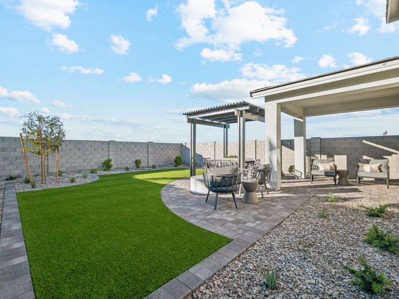 A patio with a table and chairs.