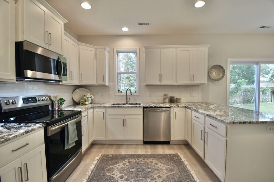 Furnished interior in a model home at River Hills in Shallotte (Image 5).