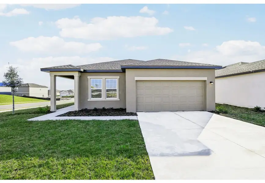 Front exterior of a home in the Sunset Hills community, located in Winter Haven, FL (Image 8).