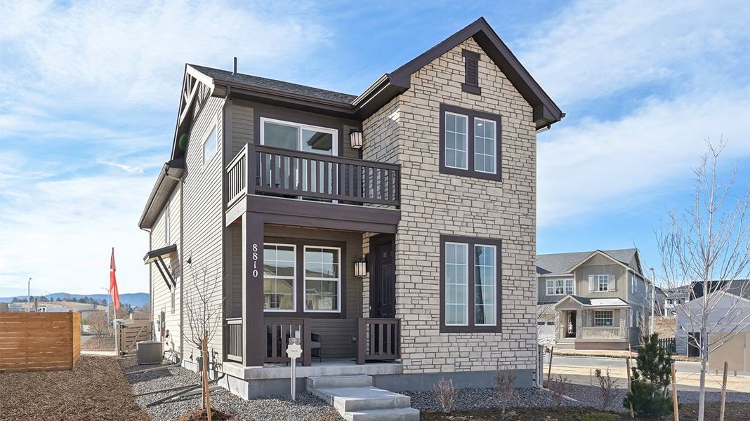 Front exterior of a home in the The Villas Collection at Sterling Ranch community, located in Littleton, CO (Image 13).