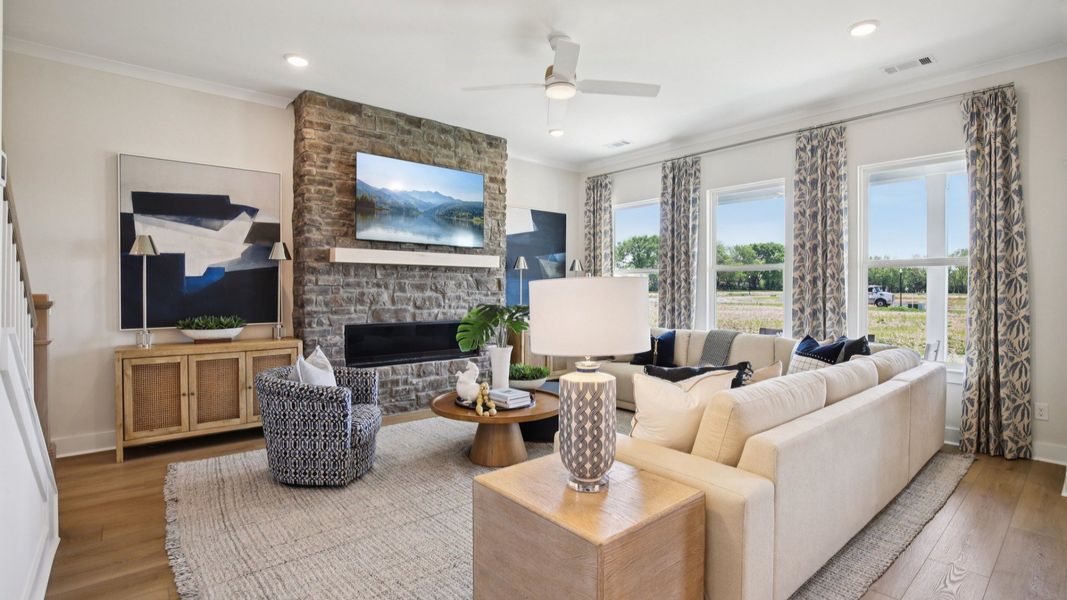 Gathering room with beautiful fireplace and natural bright light from windows Gathering room with beautiful fireplace and natural bright light from windows