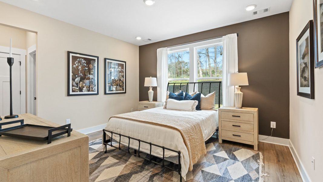 Eye-catching details and elegant finishes in the vibrant primary suite of this select home at Barton Hollow