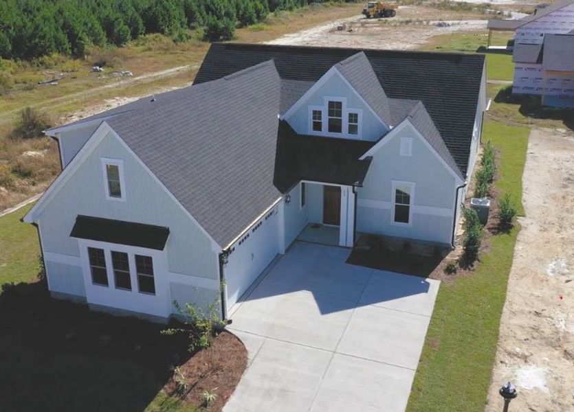 Front exterior of a home in the WyndWater community, located in Hampstead, NC (Image 5).