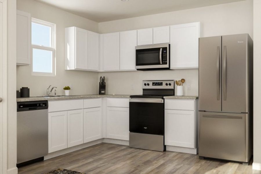 A kitchen with white cabinets. A kitchen with white cabinets.