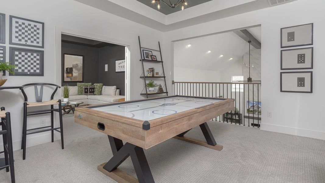 Furnished interior in a model home at Lakes Of Cane Island 60' in Katy (Image 14).