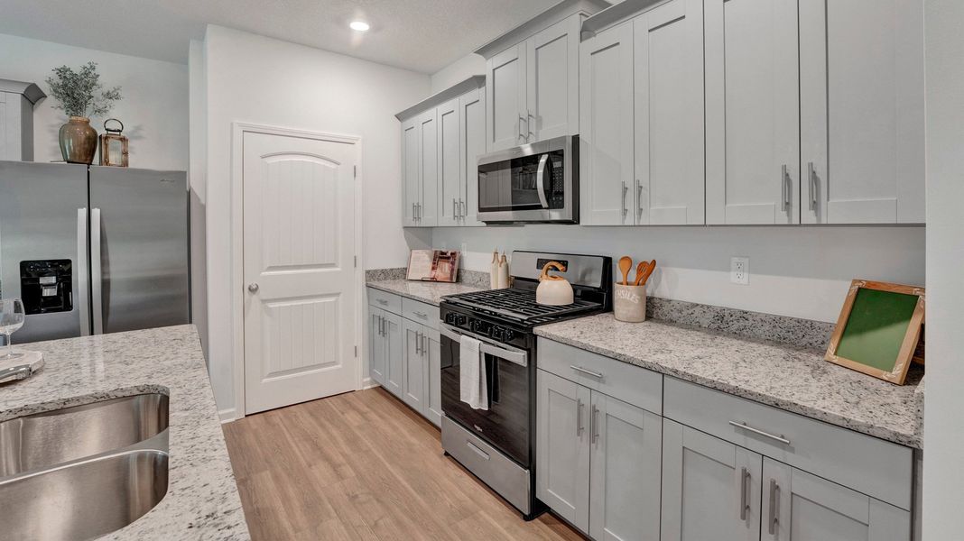 Furnished interior in a model home at Riverwood Gardens in Oakland (Image 21).
