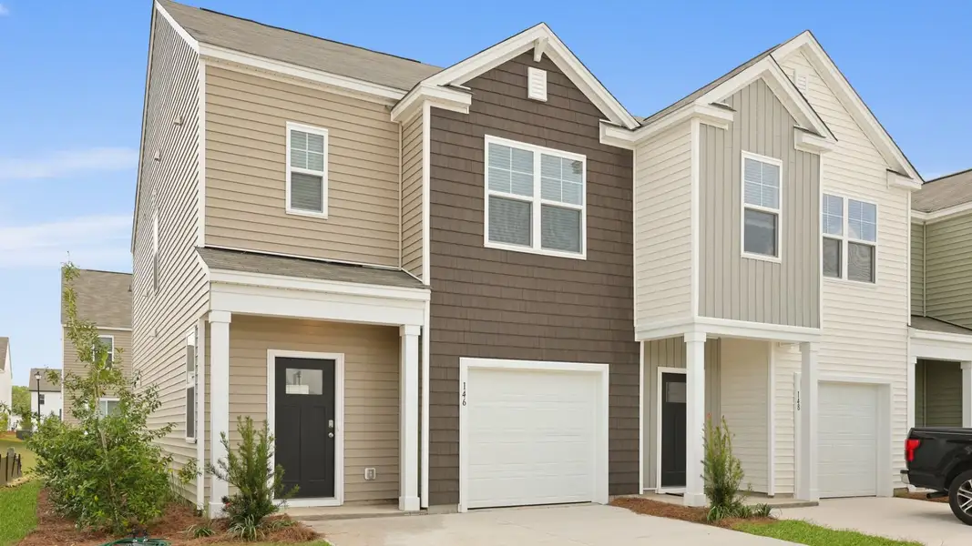 Front exterior of a home in the Carolina Groves Townhomes community, located in Moncks Corner, SC (Image 4).