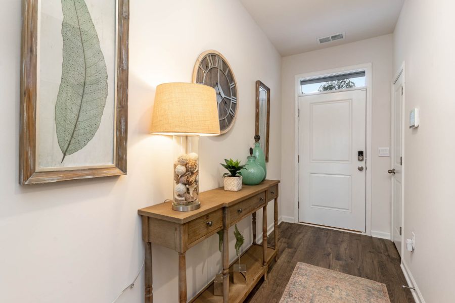Furnished interior in a model home at Island Green in Myrtle Beach (Image 48).