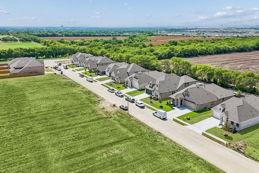 Front exterior of a home in the Parkmont – Timberbrook community, located in Justin, TX (Image 36).