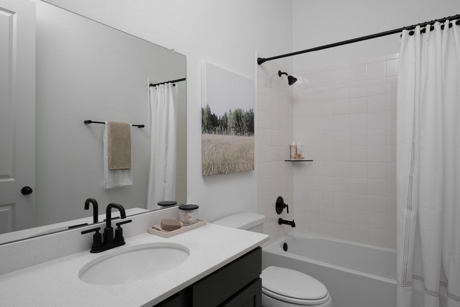 Furnished interior in a model home at Brookewater in Rosenberg (Image 12).