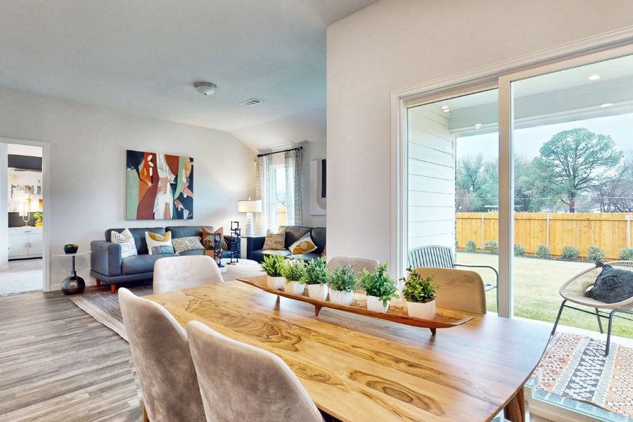 A living room with a large glass door. A living room with a large glass door.