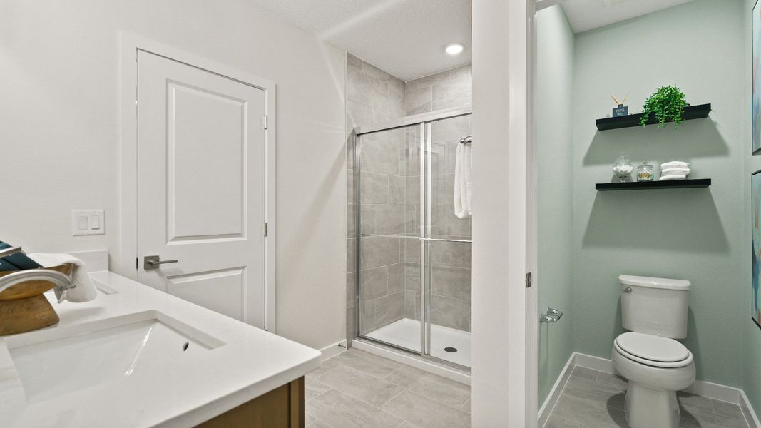 Primary En Suite Bath Willowbrook North from the Castaway Model by DRB Homes in Winter Haven FL