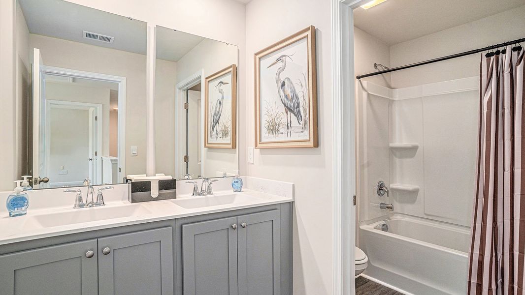 Furnished interior in a model home at Winfield Farms in Myrtle Beach (Image 17). Furnished interior in a model home at Winfield Farms in Myrtle Beach (Image 17).