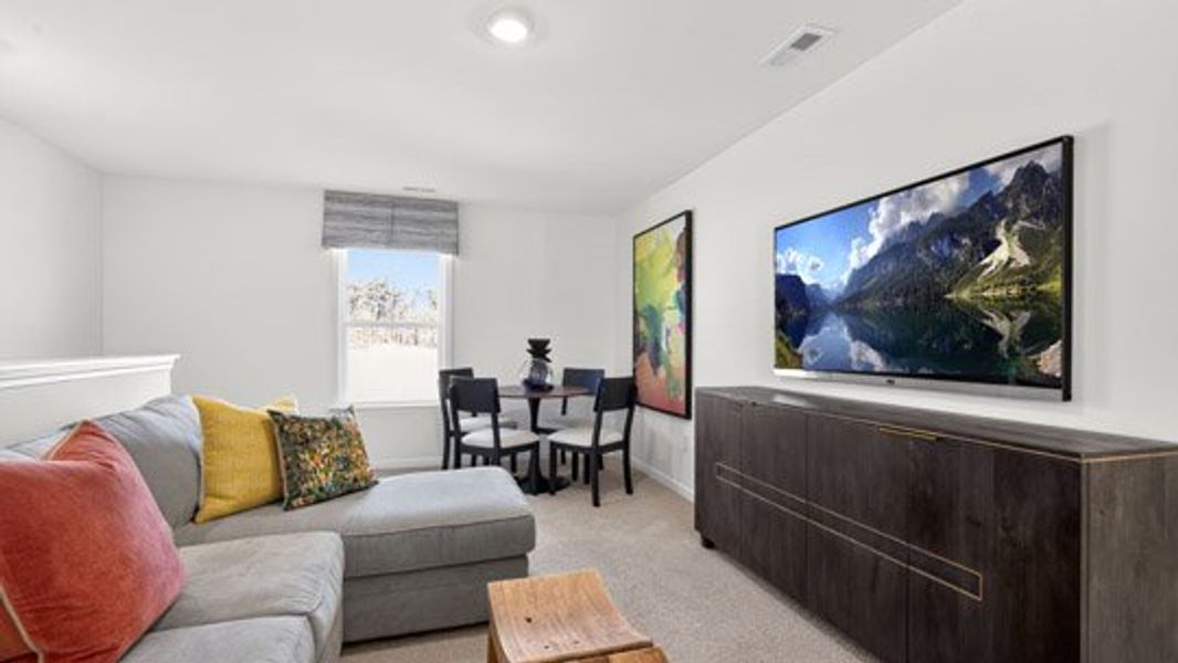 Furnished interior in a model home at The Villas at Galvins Ridge in Sanford (Image 34).